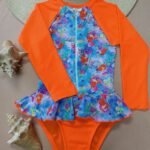 Entero infantil tipo buzo manga larga anaranjado estampado